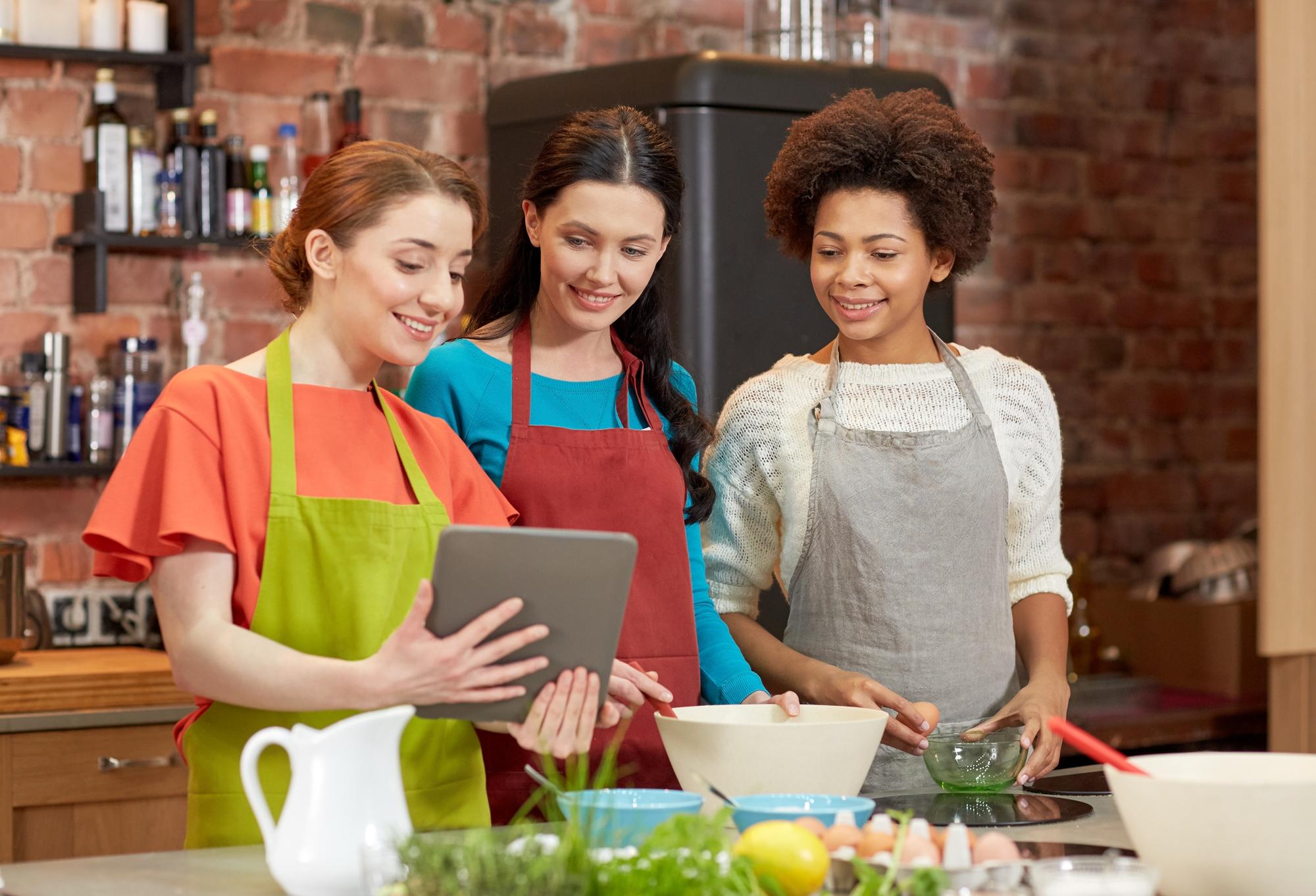 Students cooking in a small kitchen studio
